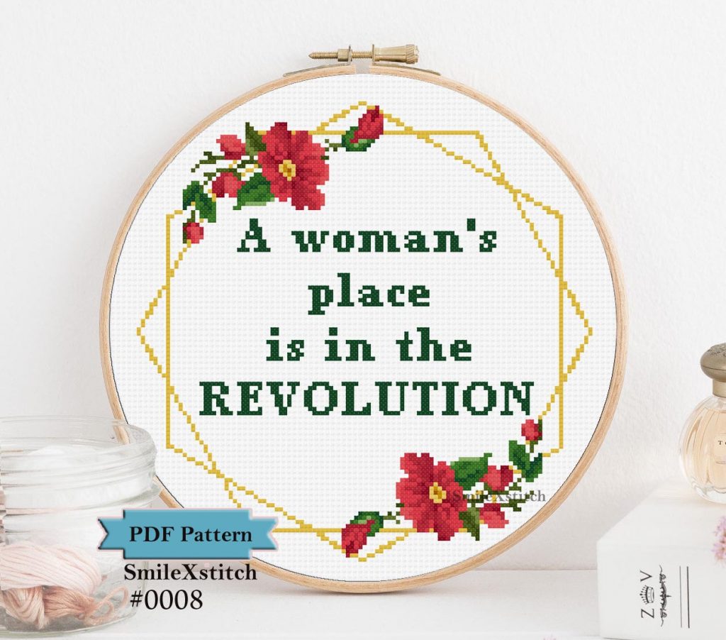 Feminist cross stitch pattern with the text "A woman's place is in the revolution"